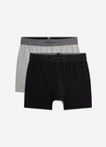 A pair of black and a pair of grey cotton stretch trunks from Percival, shown flat against a white background.
