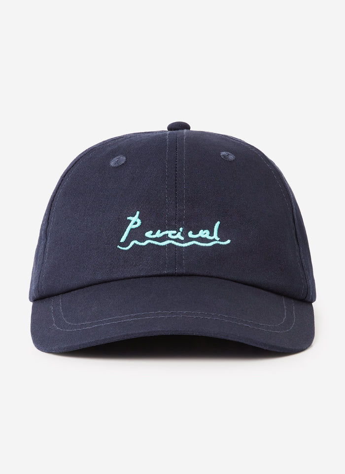 The Percival Amor cap in navy cotton, shot from the front to highlight the contrast turquoise logo embroidery.