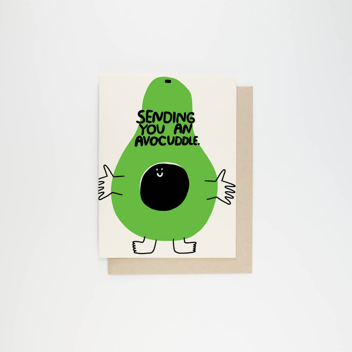 Avocado character greeting card, green avocado with message 'SENDING YOU AN AVOCUDDLE'.
