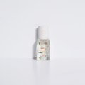 Bain de Midi eau de parfum bottle, clear glass with frosted cap and illustrated label