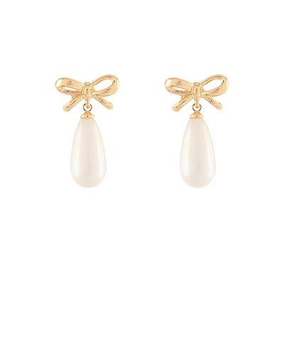 Gold bow earrings with teardrop faux pearl drops displayed on a white background from The Pink Doxie Boutique.