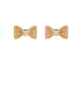 Gold bow tie stud earrings with textured metal finish displayed on a white background from The Pink Doxie Boutique.