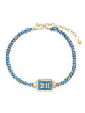 Blue braided cord spinner bracelet with gold chain and rectangular SHINE charm