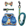 The Cat Bundle - Portofino by Sassy Woof features a blue and yellow harness, patterned bow tie, matching collar with bell, and leash—all with playful food and kitchen utensil designs.