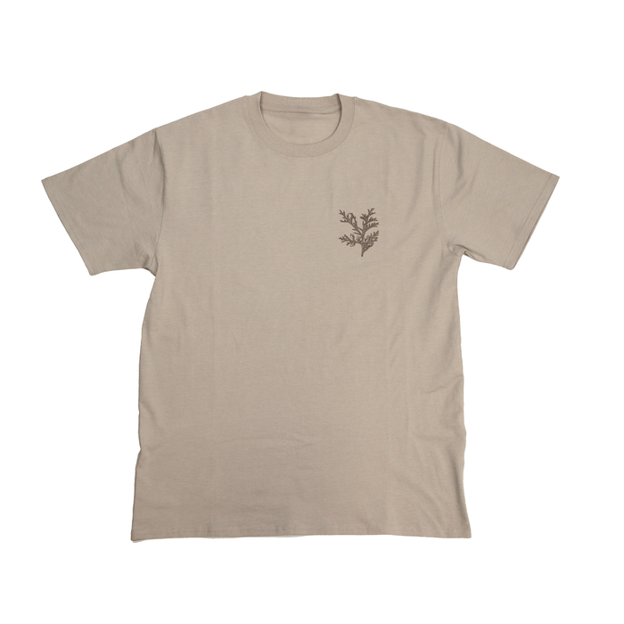 Flat lay front view of Cedar Medicine Tee in beige with simple design