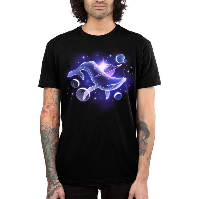 Premium Cotton T-shirt_TeeTurtle black Celestial Sea apparel featuring a celestial whale swimming in space surrounded by planets and stars.
