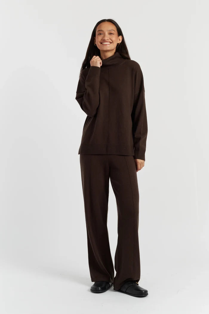 Person wearing a brown outfit on a white background