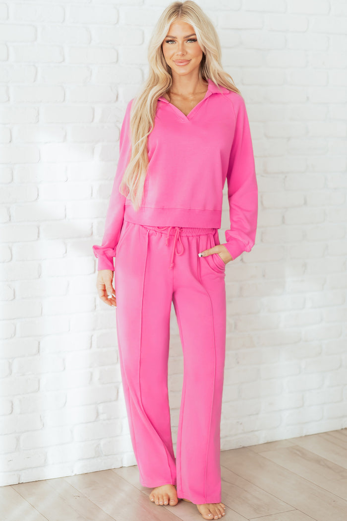 Pink collared pullover and matching drawstring pants set with central seam detail styled as a two-piece lounge outfit from The Pink Doxie Boutique.