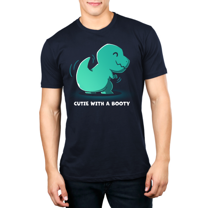 Premium Cotton T-shirt_TeeTurtle navy Cutie With a Booty Premium Cotton T-shirt featuring a happy green t-rex dinosaur wiggling its booty along with the text "Cutie With a Booty"