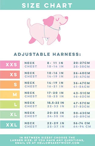 Sassy Woof Dog Adjustable Harness - Sunbean size chart with a pink dog illustration, displaying neck and chest measurements in inches and centimeters for sizes XXS to XXL in a colorful, easy-to-read table. Perfect for choosing the right adjustable dog harness or no pull harness for your pup.