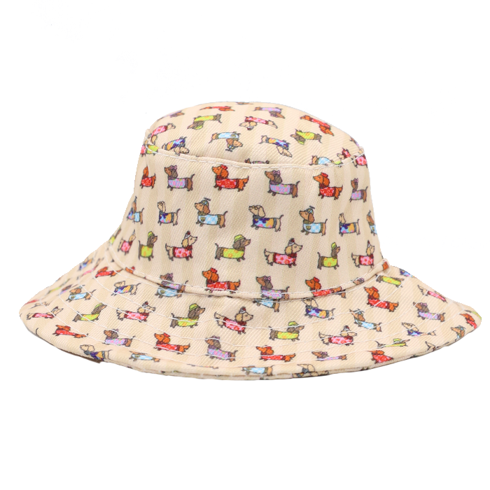 The Sassy Woof Dog Bucket Hat - Sunbean in beige features a playful pattern of small cartoon dogs in a variety of poses and colors, evenly distributed across the fabric—making it an adorable accessory that’s perfect for any dog lover.