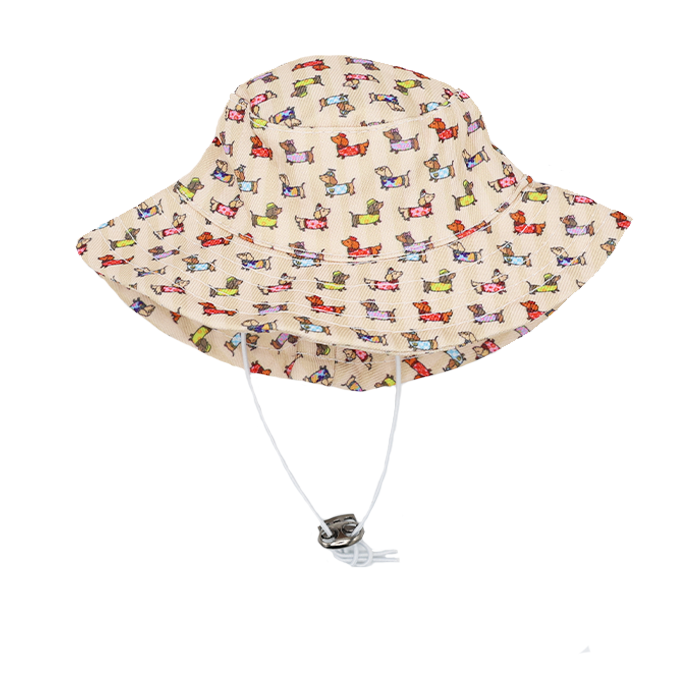 The Sassy Woof Dog Bucket Hat - Sunbean is a beige hat with a vibrant Doxie pattern and an adjustable white chin strap.