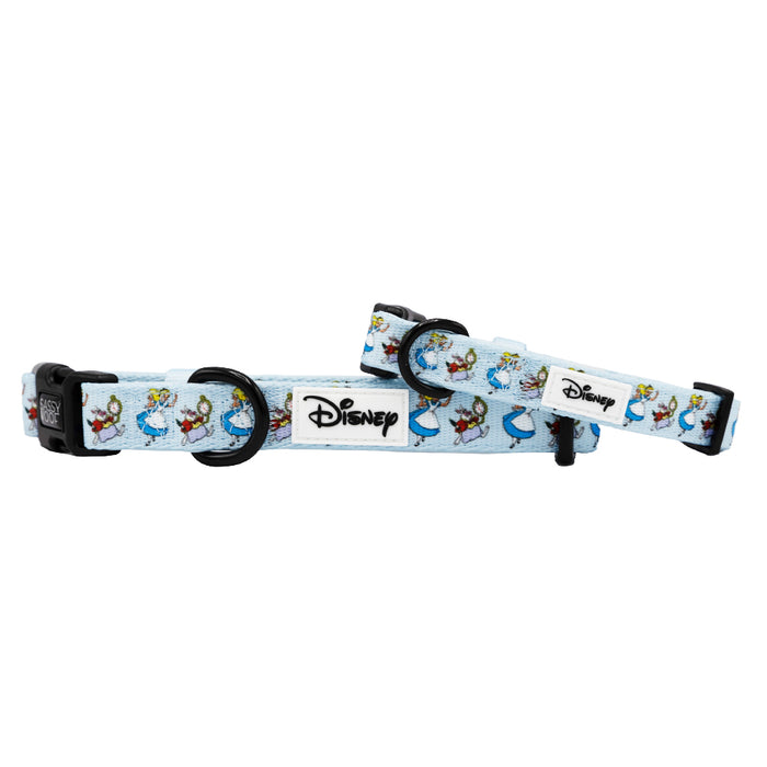 Light blue adjustable dog collar with black buckle and rings, featuring cartoon images of Disney’s Alice in Wonderland. A white patch with the black Disney logo is sewn at the center. Crafted by Sassy Woof for style and comfort.