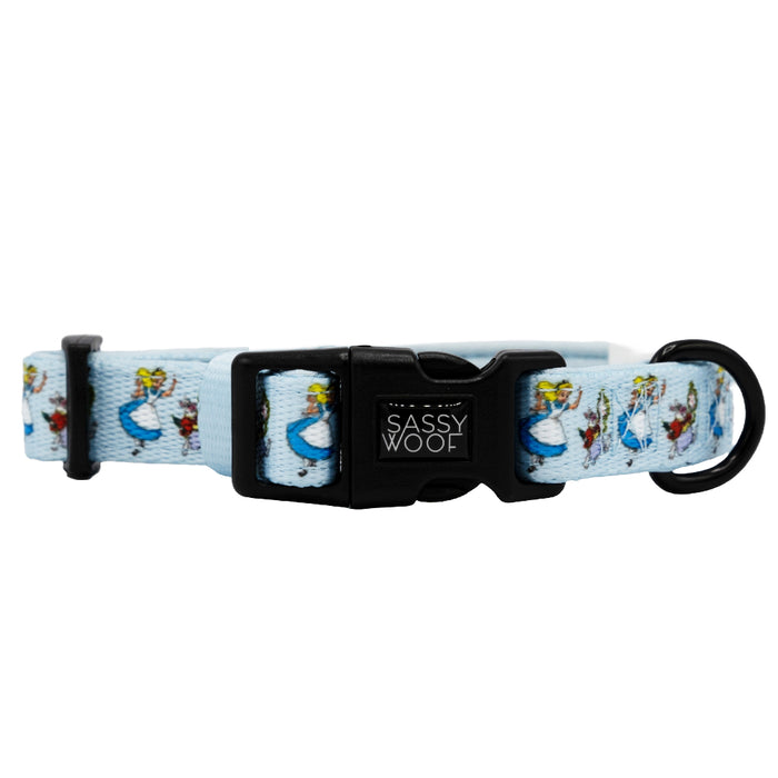 The Sassy Woof Dog Collar - Alice in Wonderland (Blue) features whimsical cartoon ducks, a sturdy D-ring, and a black plastic buckle. Inspired by Alice in Wonderland, this adjustable collar is perfect for your dog’s playful style.