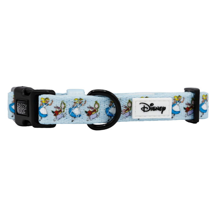 A blue adjustable Sassy Woof dog collar featuring Disney’s Alice in Wonderland design with cartoon characters, a sturdy metal ring, and a black plastic buckle.
