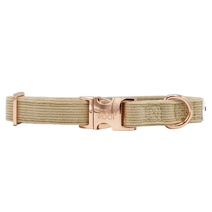The Sassy Woof Dog Collar - Best Pup in beige corduroy features an adjustable fit with a rose gold metal buckle and D-ring engraved with the brand logo, blending style and comfort for your dog. Displayed on a white background.