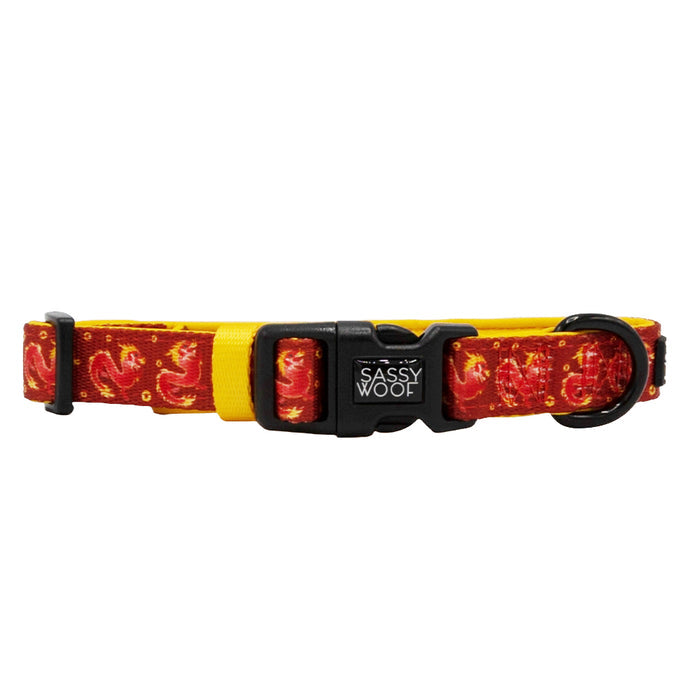 The Sassy Woof Dog Collar - Lucky Dragon features a vibrant red and yellow flame pattern, sturdy metal ring, and black plastic buckle—a stylish adjustable choice for Lunar New Year celebrations.