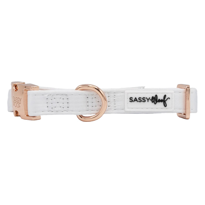 The Sassy Woof Pup of Honor dog collar features white satin, rose gold hardware, a D-ring, and an adjustable fit—making it the perfect wedding accessory for your stylish pup.