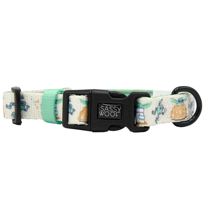 The Sassy Woof Dog Collar - STAR WARS™ The Child™ features a white neoprene design with pastel green accents, a black plastic buckle, adjustable fit, secure leash attachment, and playful multi-color character pattern.