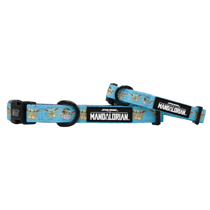 Two blue Sassy Woof Dog Collars - STAR WARS™ The Mandalorian™, featuring Baby Yoda (Grogu) illustrations, neoprene material, black plastic buckles, metal rings, and sturdy leash attachments—perfect for daily walks.