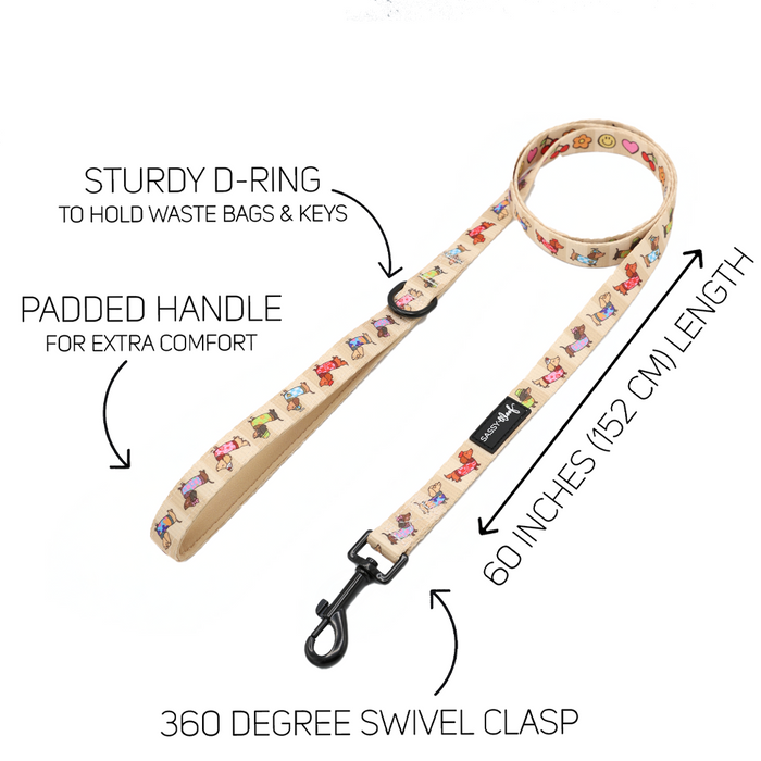 The Sassy Woof Dog Leash - Sunbean features a charming beige Doxie pattern with vibrant dog illustrations, a sturdy D-ring for bags and keys, a comfortable padded handle, 60-inch (152 cm) length, and a 360-degree swivel clasp—perfect for pairing with your matching dog accessories.