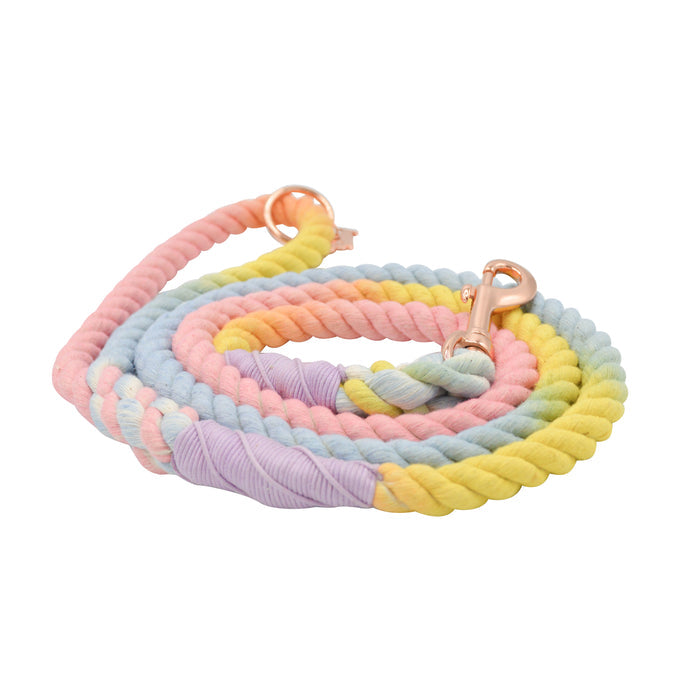 The Sassy Woof Dog Rope Leash - Fiesta features soft cotton in ombre pastel pink, blue, yellow, green, and purple shades with a rose gold hardware clasp.