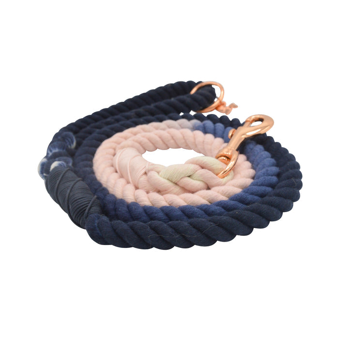 The Sassy Woof Dog Rope Leash - Moonlight features a stylish ombre gradient from dark navy blue to light pink, accented with rose gold hardware and metal clips at both ends.