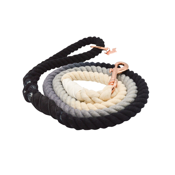 The Sassy Woof Dog Rope Leash - Ombre Black features a hand-crafted ombre design fading from black to gray to cream, finished with stylish rose gold hardware.