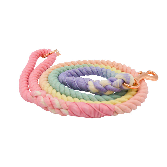 The Sassy Woof Dog Rope Leash - Rainbow Bright features twisted cotton in pastel pink, yellow, green, and lavender with sleek rose gold hardware for a stylish look.