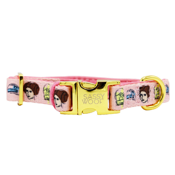The Sassy Woof Dog Three Piece Bundle - STAR WARS™ Princess Leia features a pink collar with gold hardware and engraved buckle, decorated with cartoon images of Princess Leia from the collection.