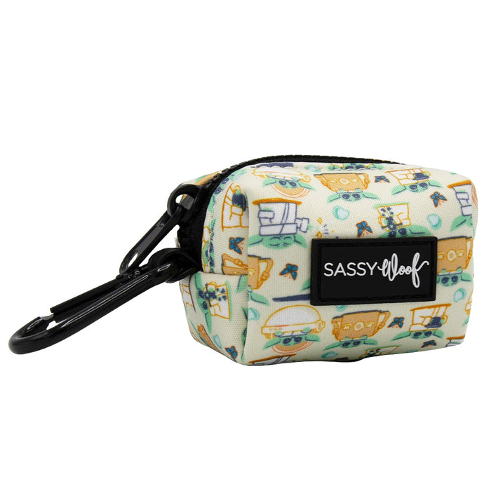 The Sassy Woof Dog Waste Bag Holder - STAR WARS™ The Child™ is a small, rectangular, zippered neoprene pouch with a black clip and SASSY WOOF patch—perfect as a stylish dog leash accessory.