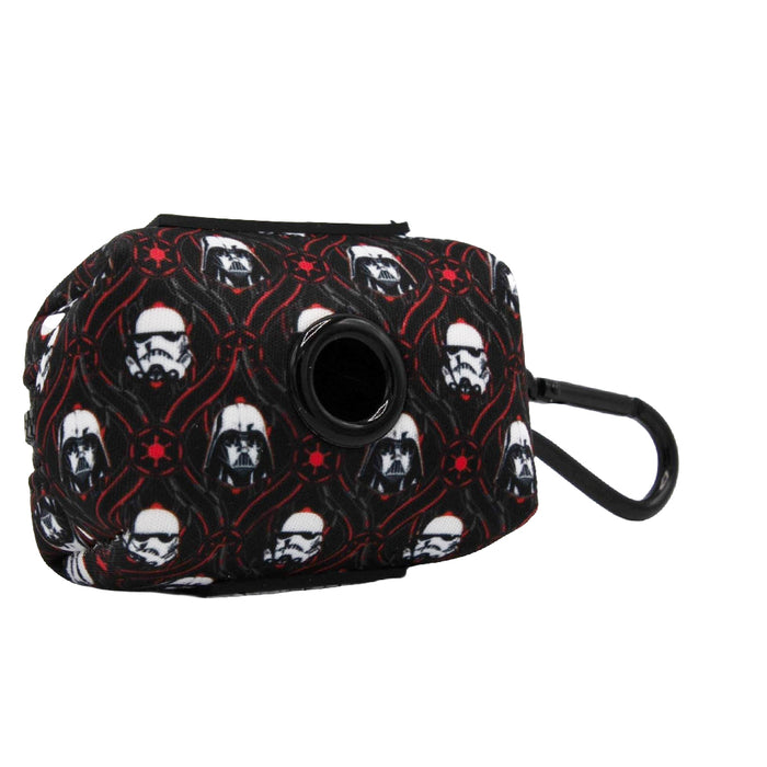 The Sassy Woof Dog Waste Bag Holder - STAR WARS™ The Dark Side features a small black neoprene design with white helmeted figures, red accents, a circular opening, and clip—ideal to match your favorite dog accessories or harness.