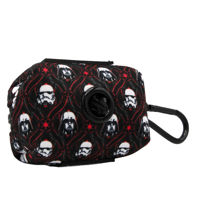The Sassy Woof Dog Waste Bag Holder - STAR WARS™ The Dark Side features black neoprene with white helmeted skulls and red biohazard symbols, a circular dispenser, and a black clip—ideal for pairing with your favorite dog accessories or harness.