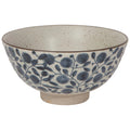 Large ceramic bowl with speckled stone finish and blue leaf and dot pattern