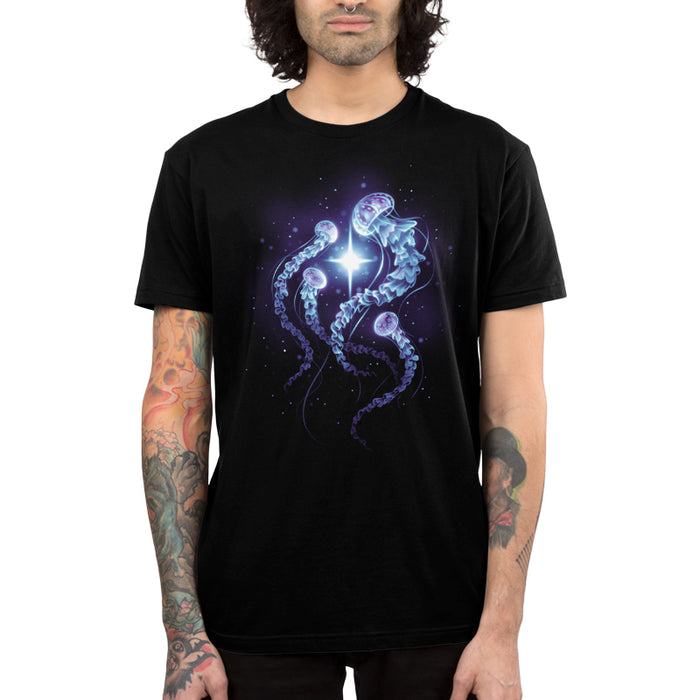 Premium Cotton T-shirt_TeeTurtle black Enchanting Jellyfish apparel featuring a smack of four blue, and purple jellyfish swimming around a bright white light in the deep ocean.