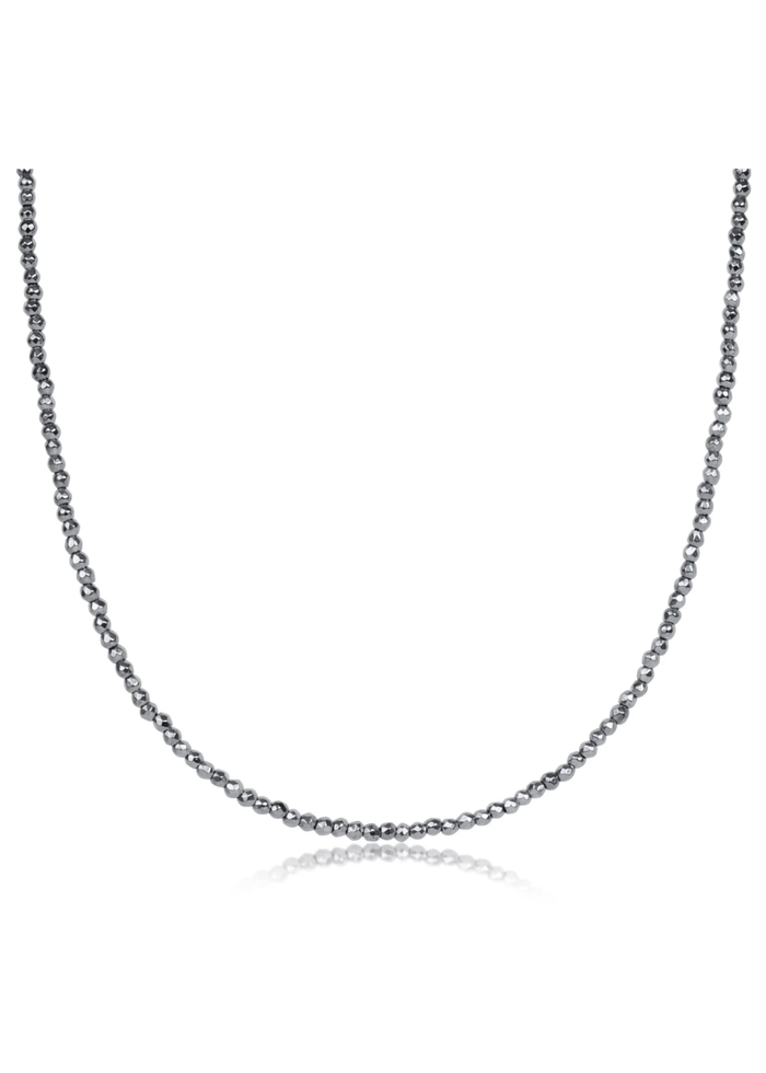 Silver beaded choker necklace on a white background