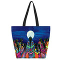 Tote bag with colorful design of people under a moonlit sky on a white background