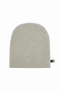 A beige fleece wool cap with a small black tag on the side, photographed against a solid white background.