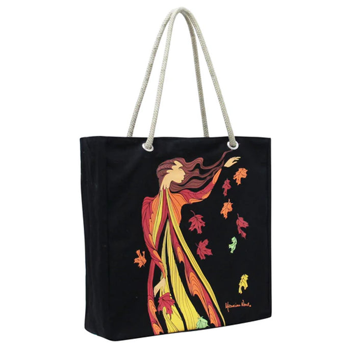 Black tote bag with colorful artistic design of a woman and leaves on a white background