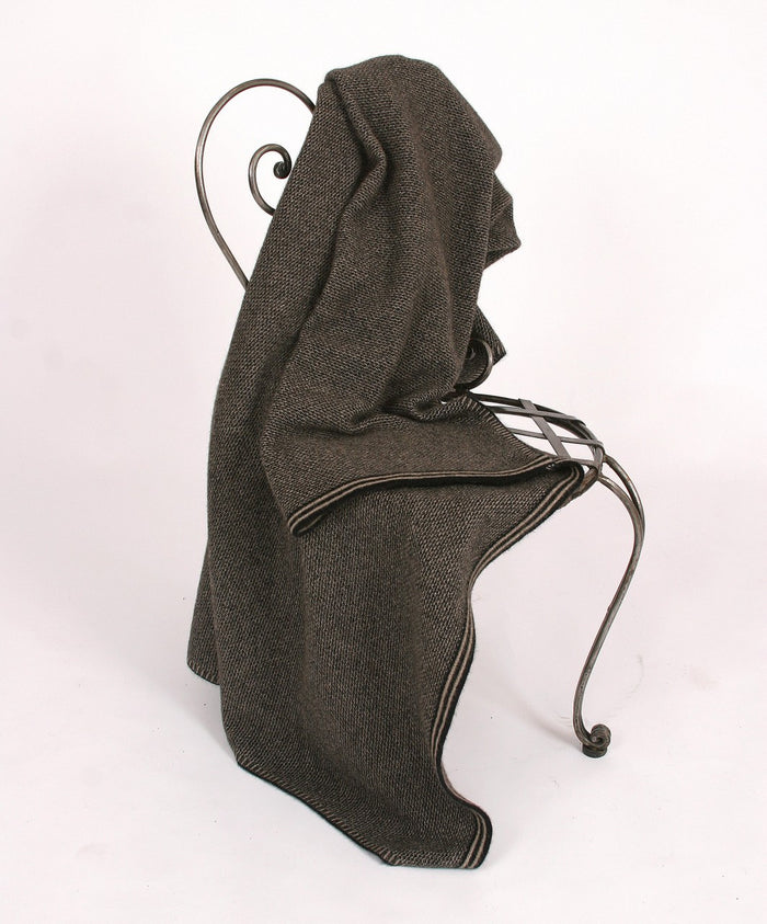 Lightweight blanket on chair. Colour Black/Natural