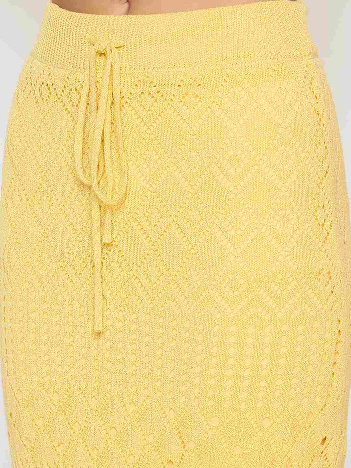 Yellow knitted skirt with drawstring waist on a white background