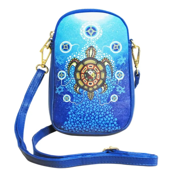 Medicine Turtle Phone Bag featuring a turtle design, crafted by artist James Jacko, in blue synthetic leather.