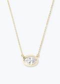 Women's gold pendant necklace with a gold framed diamond pendant