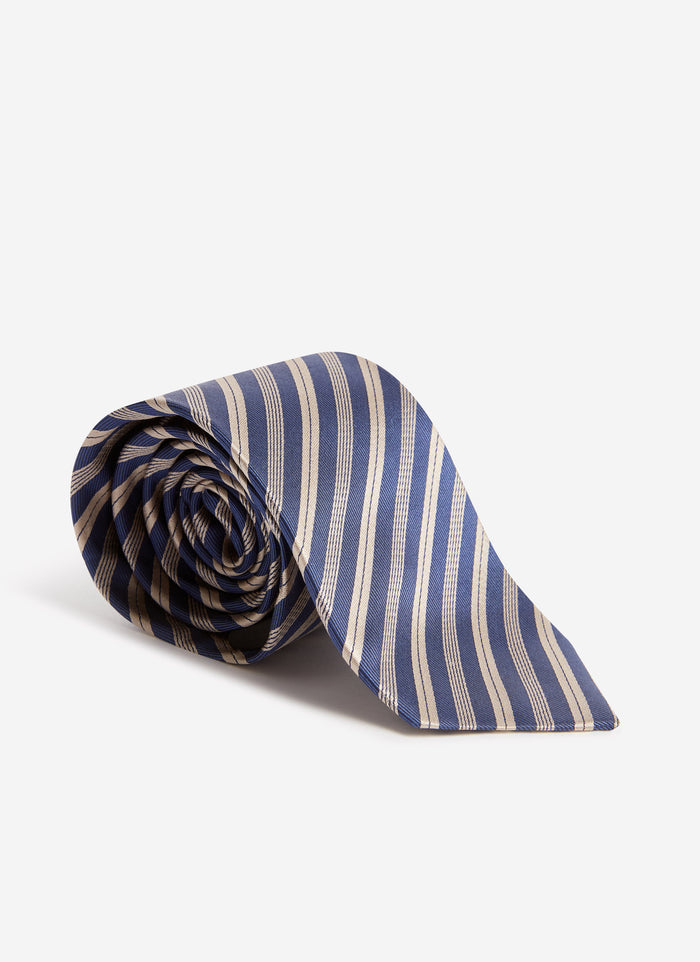 A studio shot of the Percival Micro Stripe Silk Tie in burgundy and navy, neatly rolled against a white background.