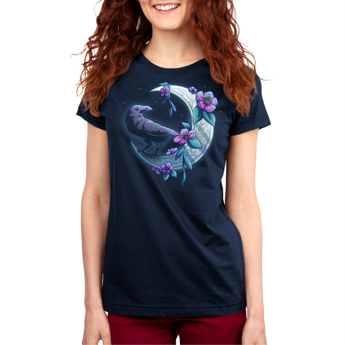 Premium Cotton T-shirt_TeeTurtle navy blue Midnight Perch Premium Cotton T-shirt featuring a raven perched and glowing atop a fancy crescent moon with pink flowers and stars in the background