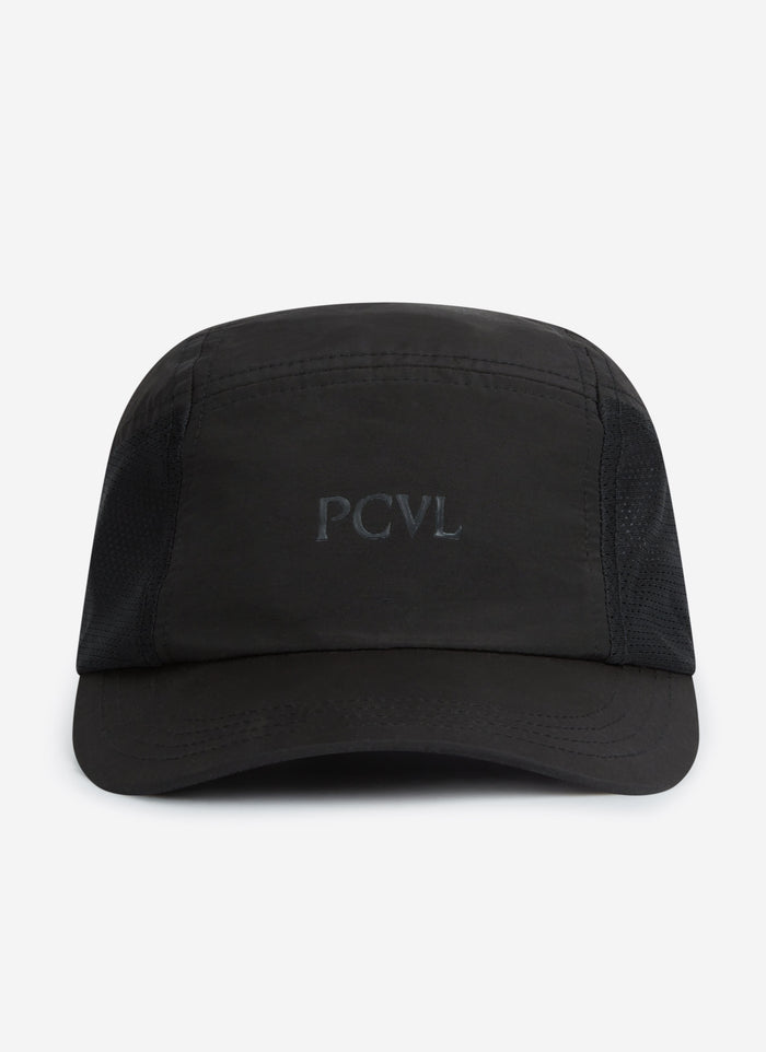 A front-on studio photograph of the black PCVL Nylon Cap by Percival, showing the tonal 'PCVL' embroidery.