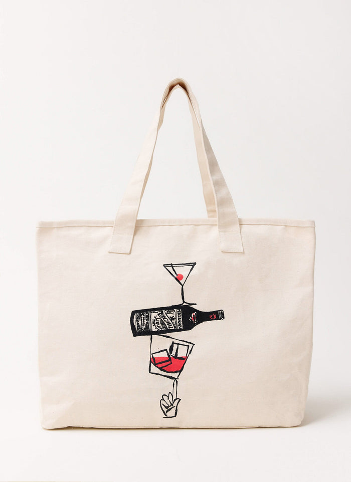 The ecru cotton Perci and Rossi Martini tote bag by Percival, featuring a hand-illustrated cocktail graphic.
