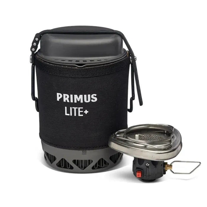 A Primus Lite Plus Gas Stove System II 800ml in black shown with the lid closed and the burner next to the cooking pot on a white background.