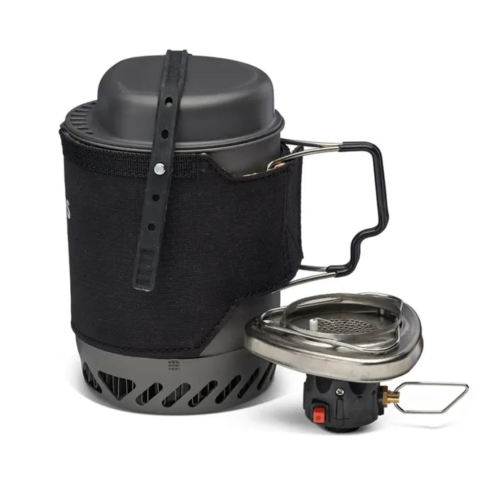 A Primus Lite Plus Gas Stove System II 800ml in black shown from the side with the handles extended with the burner next to the cooking pot on a white background.