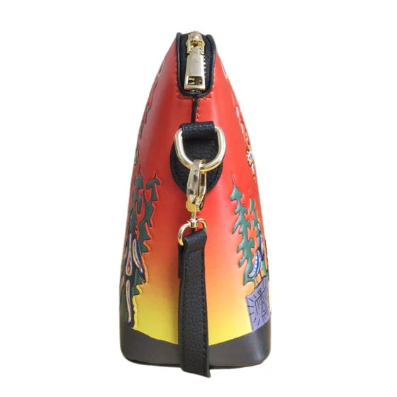 Colorful handbag with artistic design on a white background